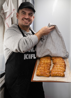 Photo of Milo holding freshly baked kiflice